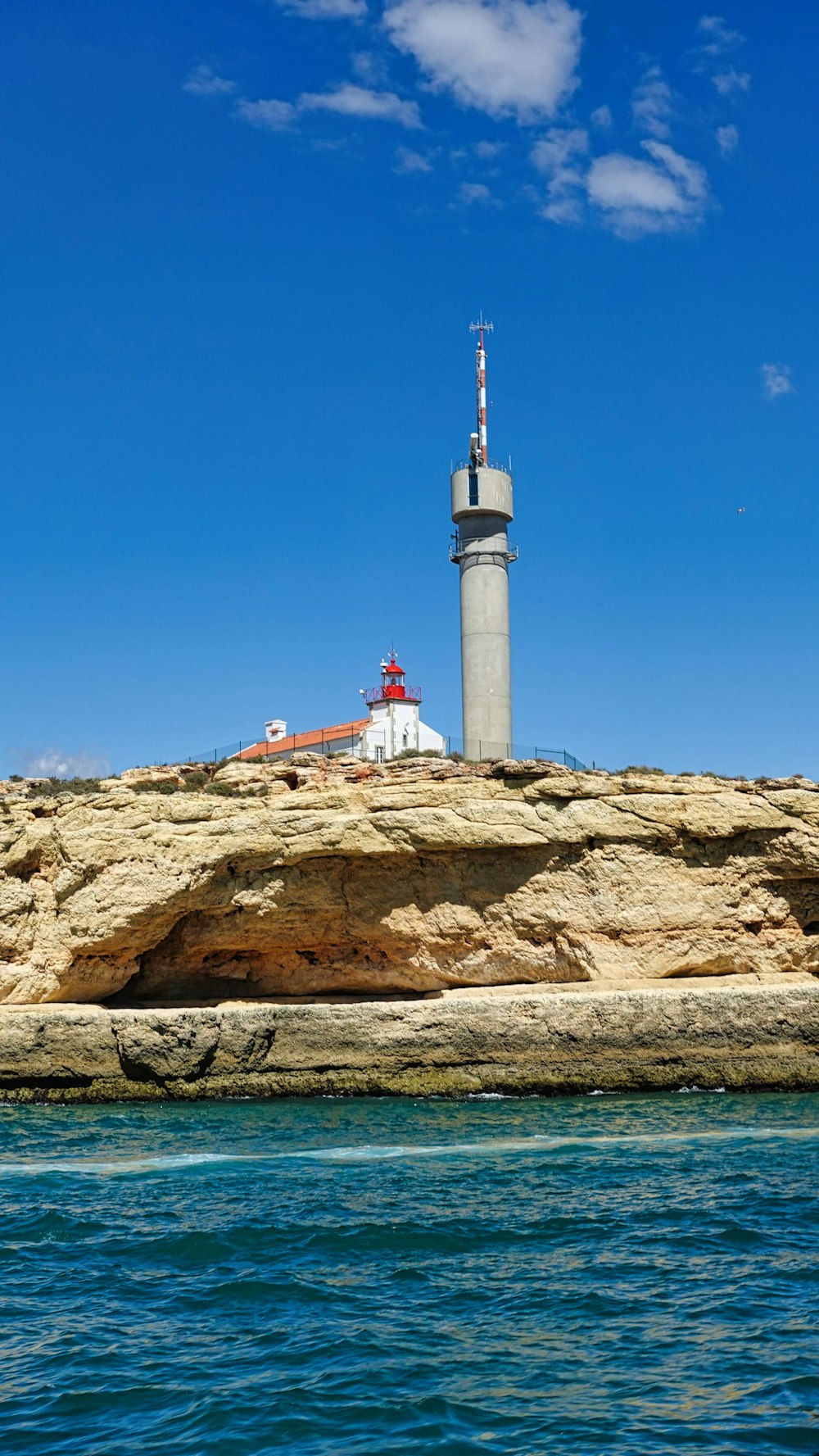 a lighthouse on a rocky cliff