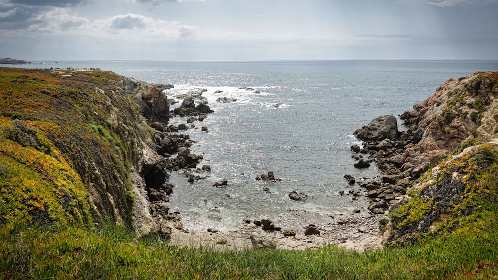 a rocky beach with waves crashing on it