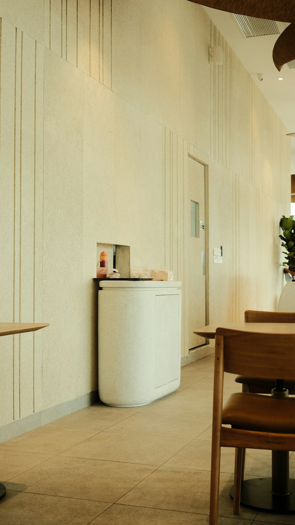 a white room with a table and chairs