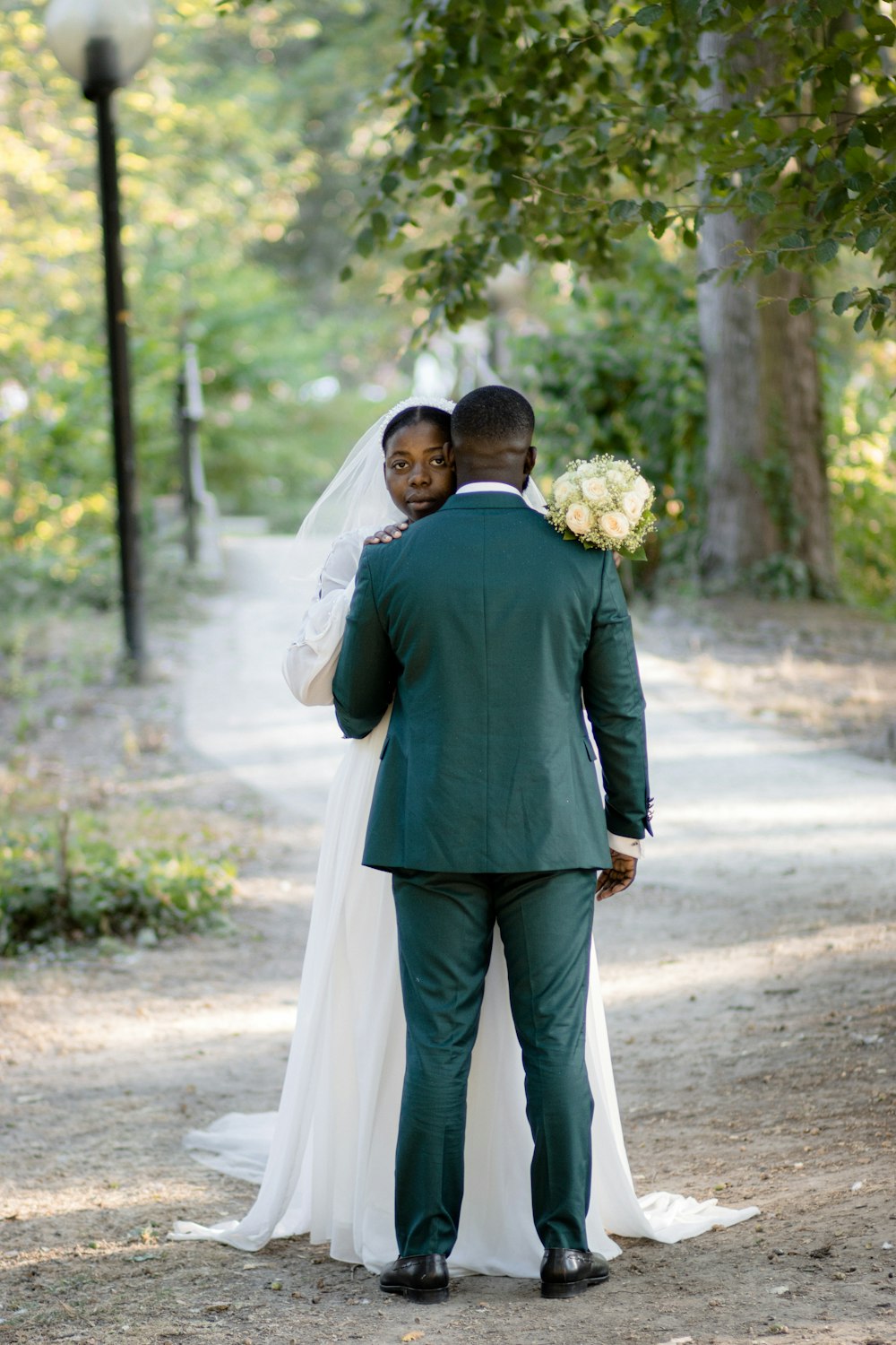 a man and woman in wedding attire