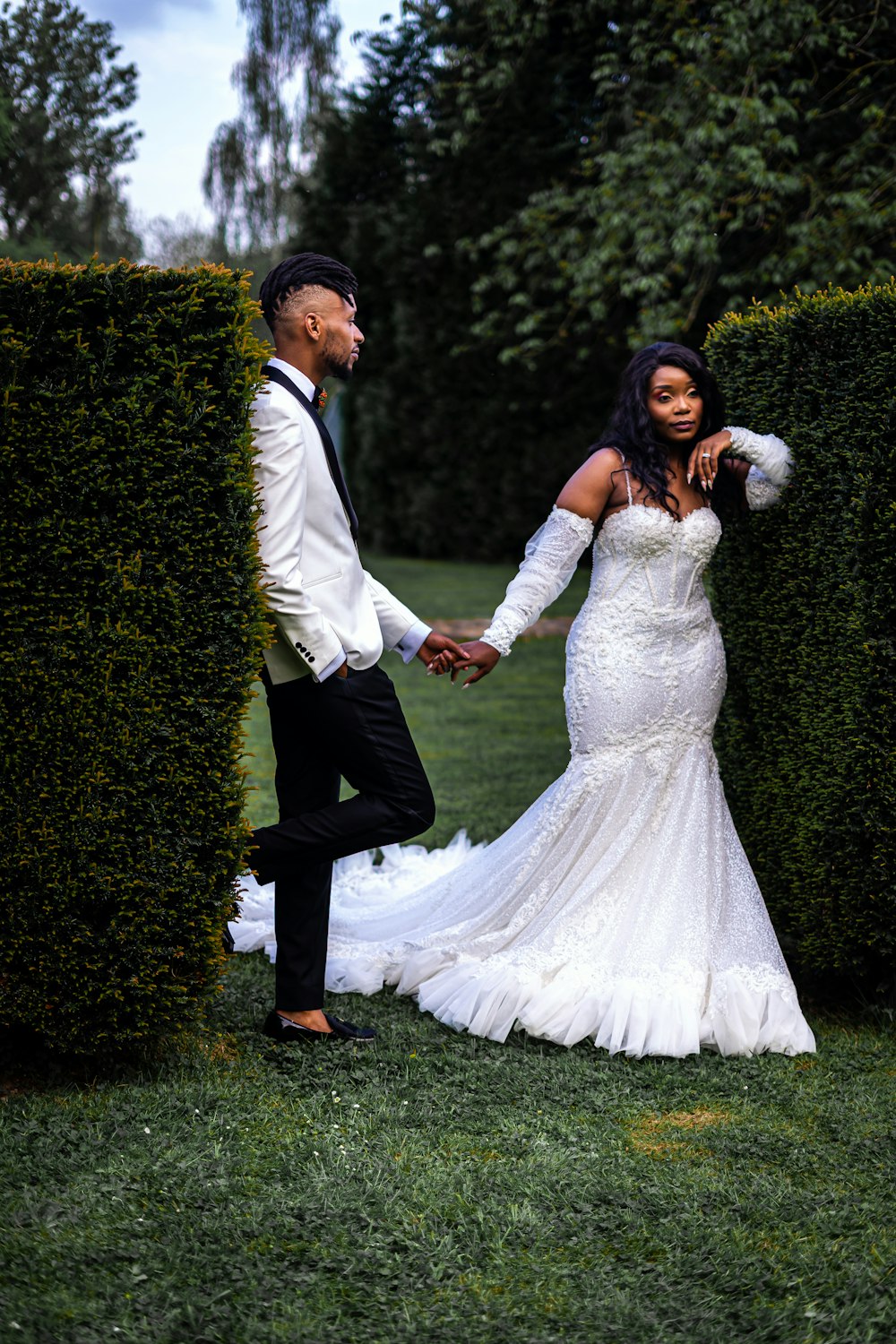 a man and woman in wedding attire