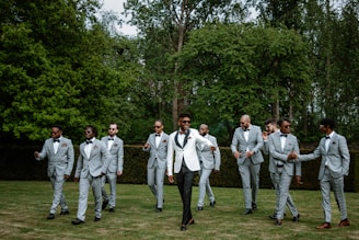 a group of men in suits walking