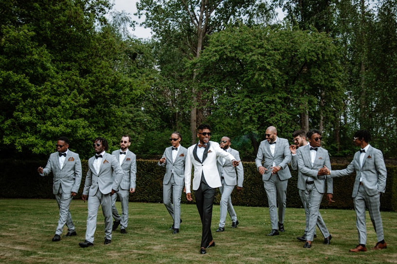 a group of men in suits walking