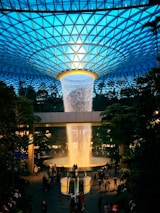 a large glass dome with people walking around