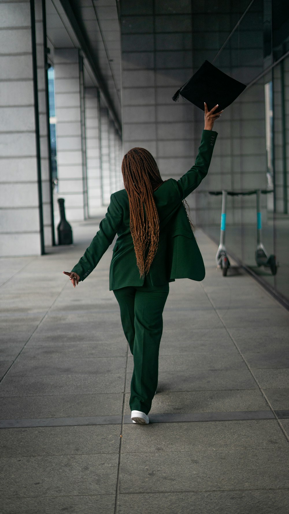 a person holding a black umbrella