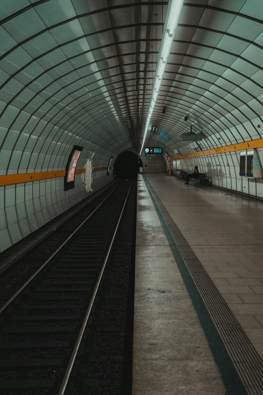 a train station with people waiting