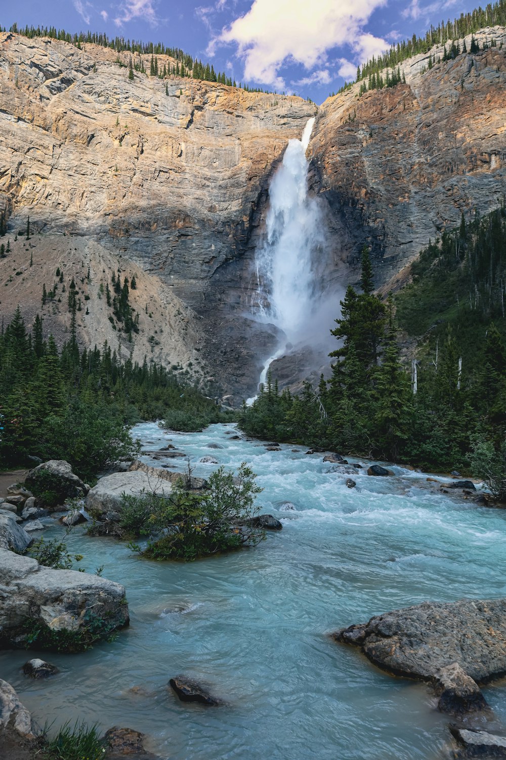 a waterfall over a rocky cliff