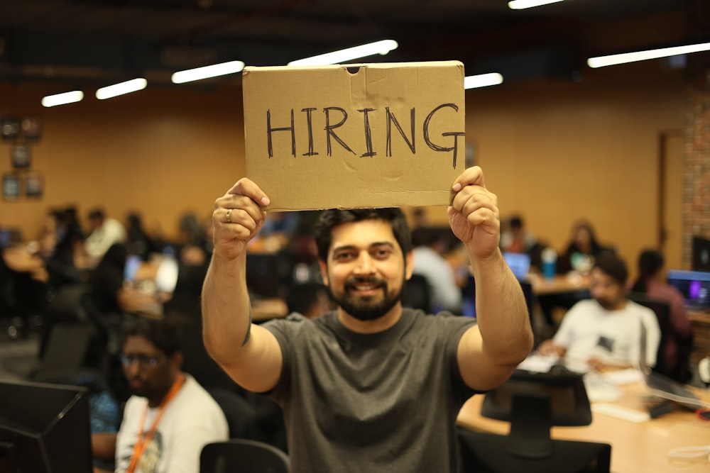 a man holding a sign