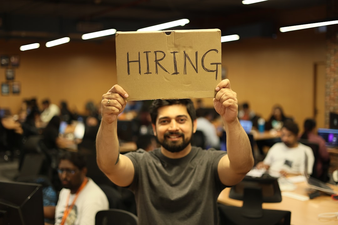 a man holding a sign,