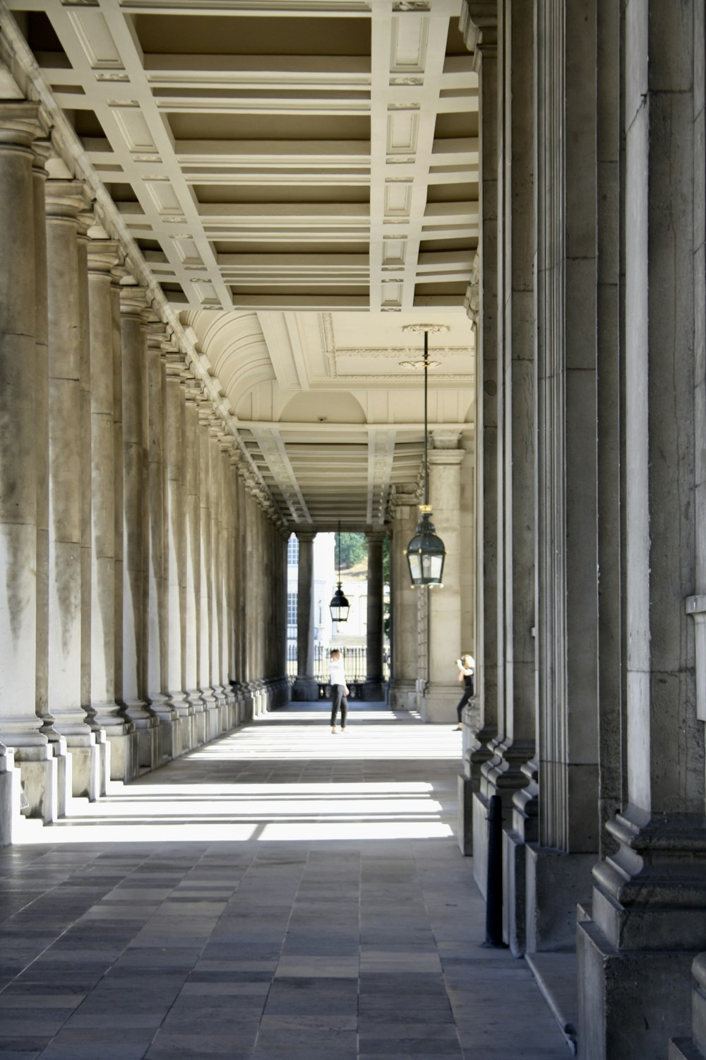 a person walking down a walkway