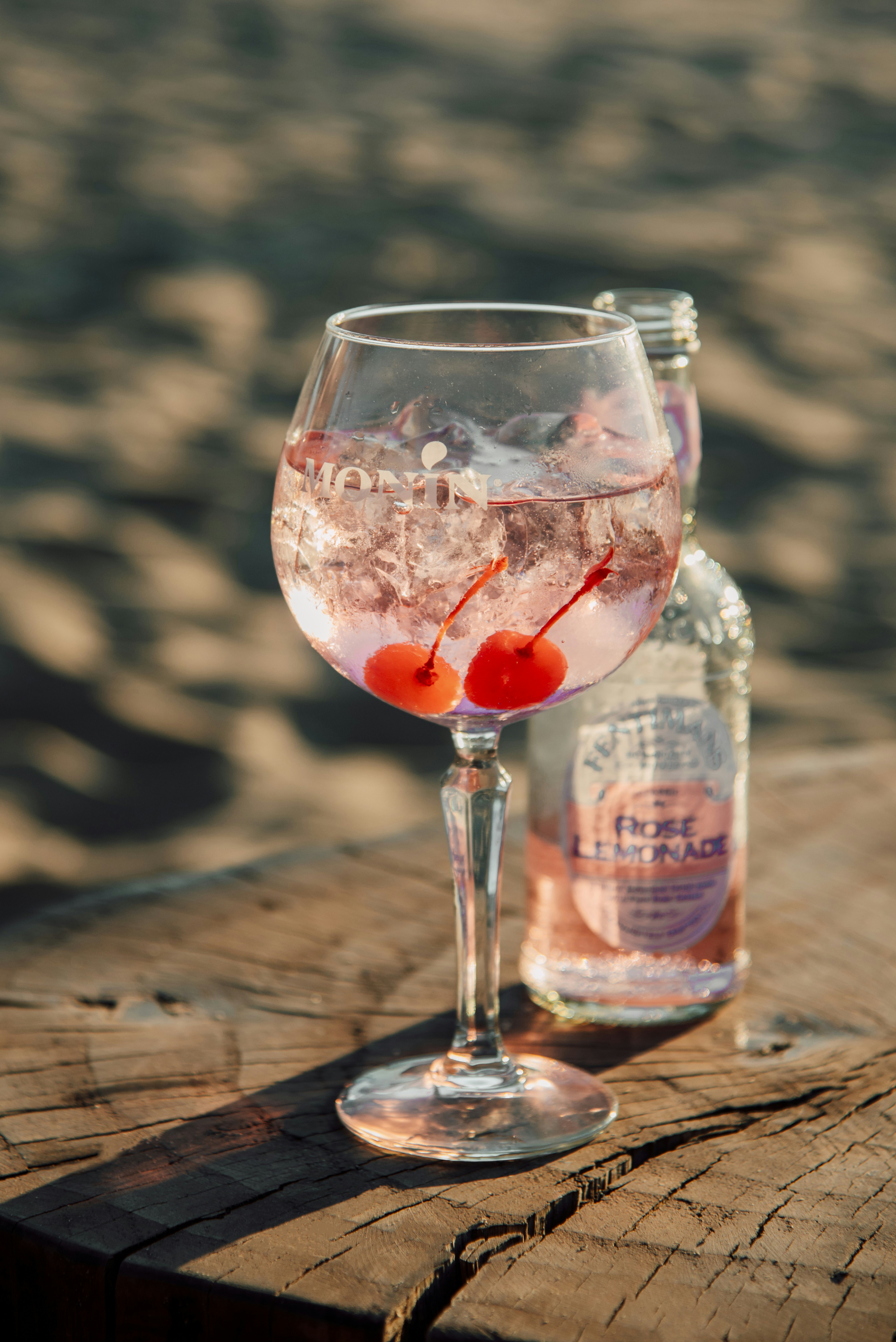 a glass of liquid and a bottle