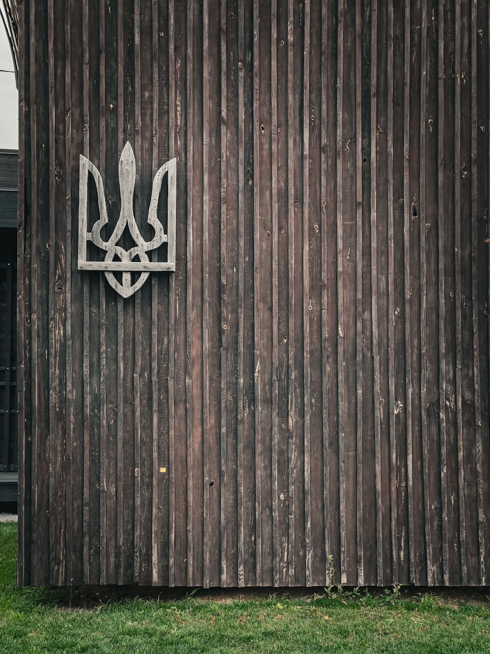 a wood fence with a sign on it