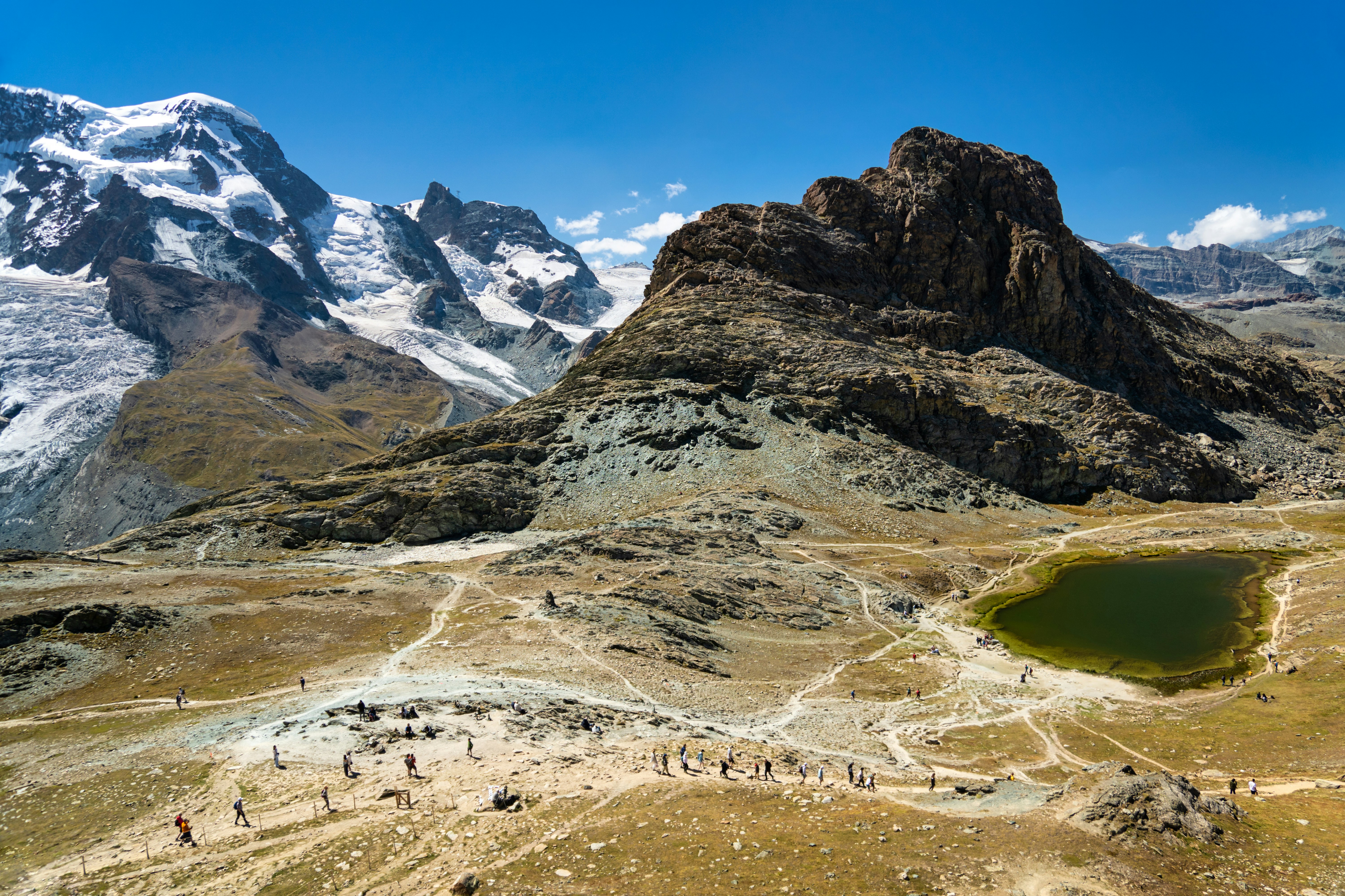 a large mountain with a lake in front of it