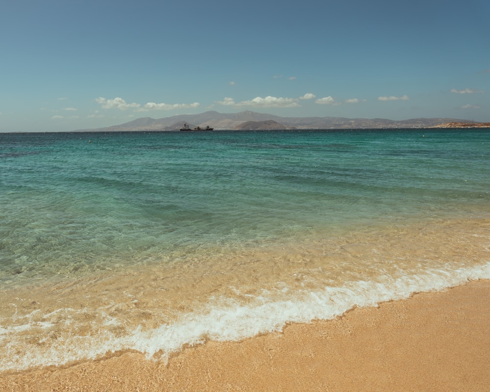 a beach with clear blue water