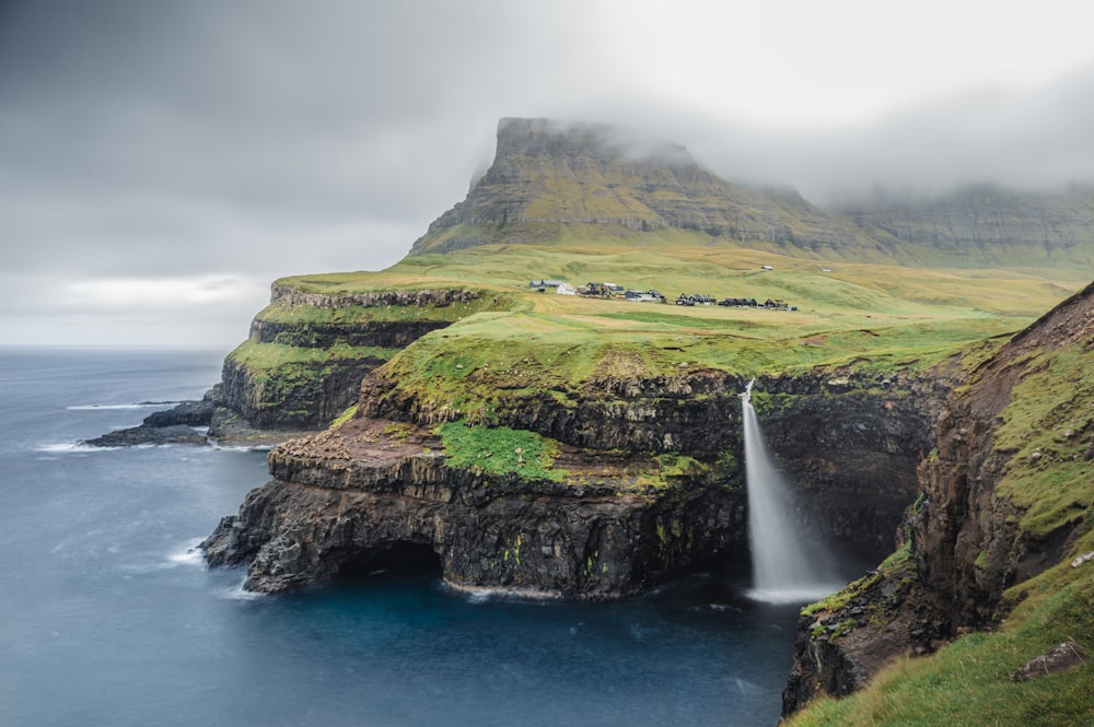 a waterfall on a cliff