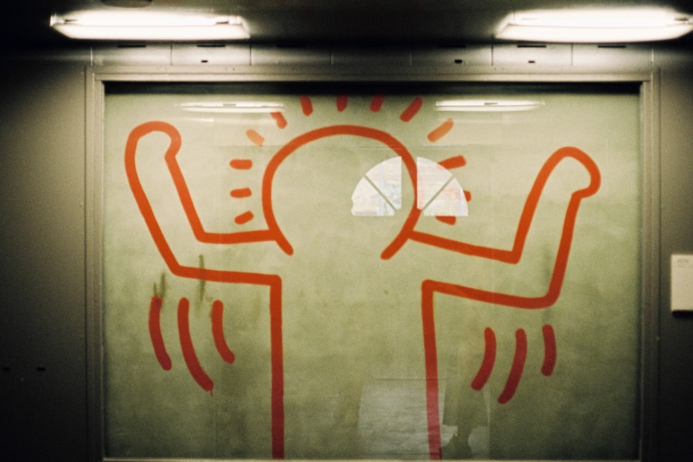 a white board with red writing