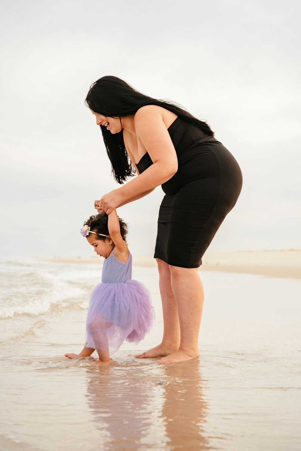 a person and a child on a beach