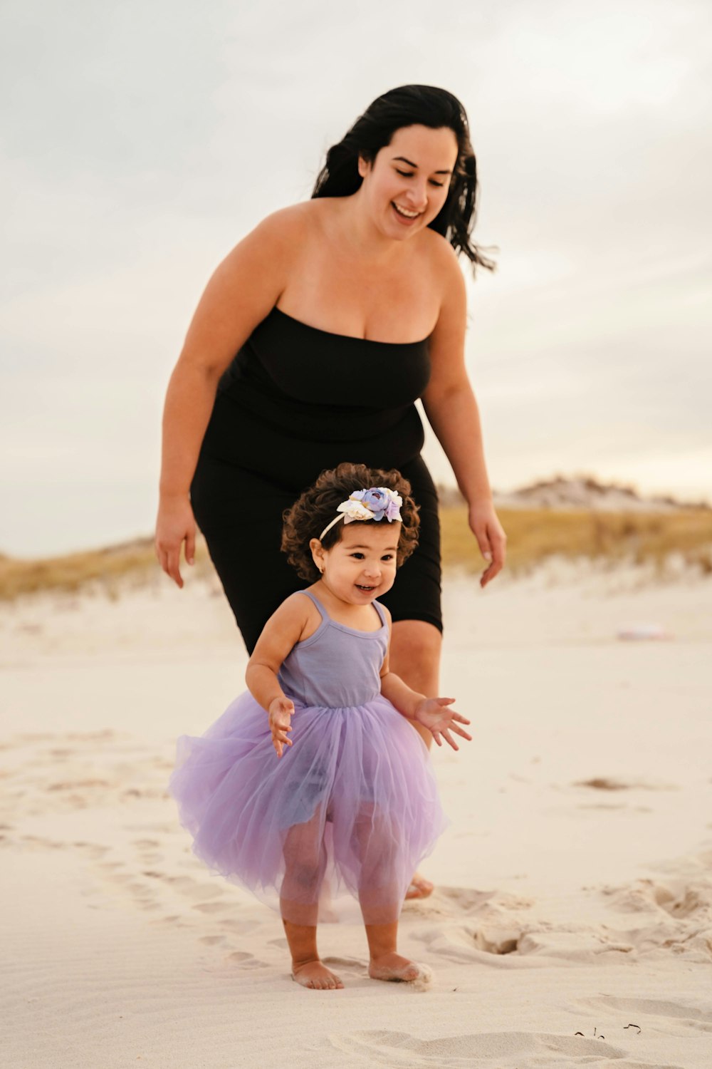 a person and a child on a beach