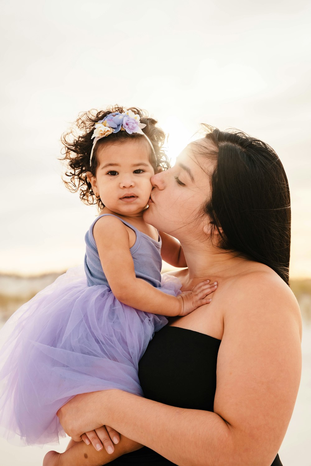 a woman holding a baby