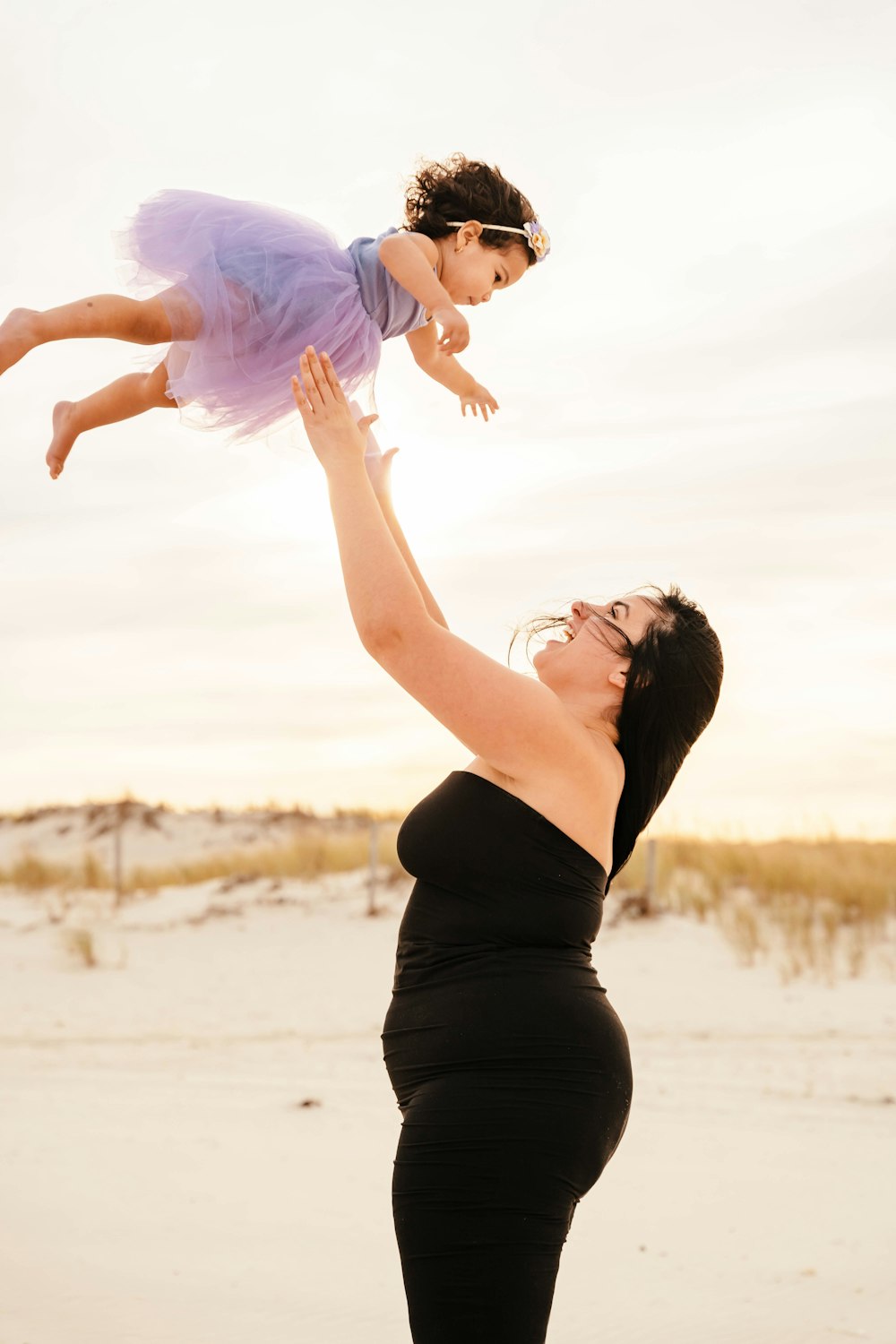 a woman holding a baby