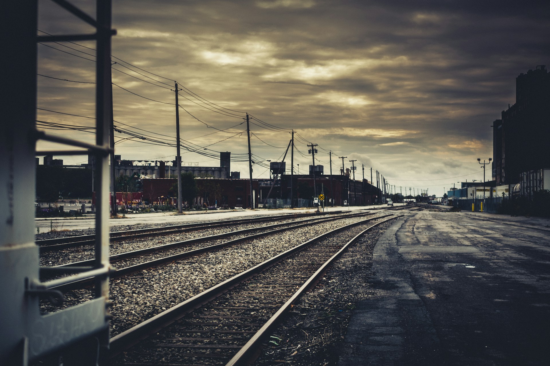 train tracks with buildings in the background