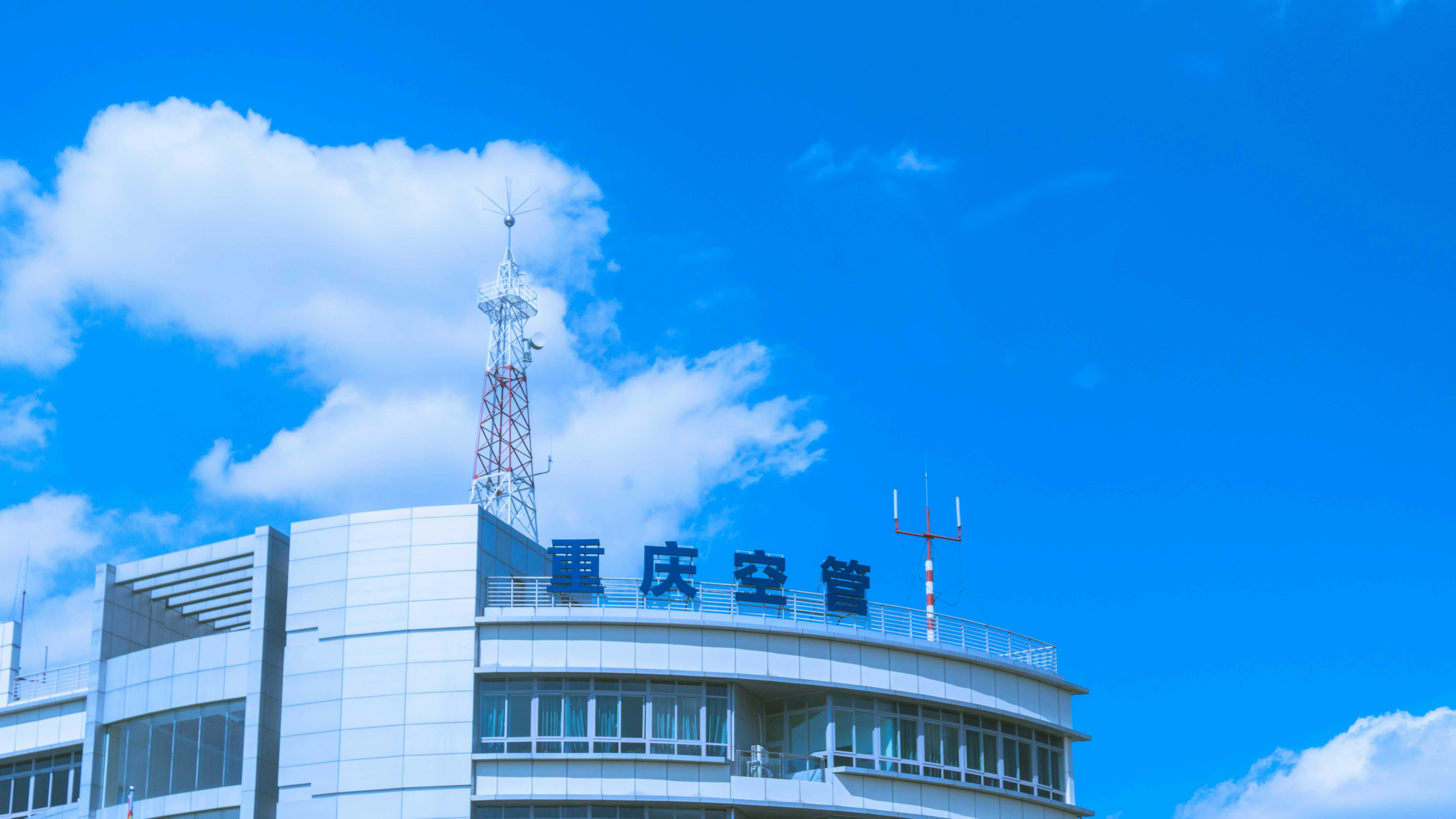 a building with a tower in the background