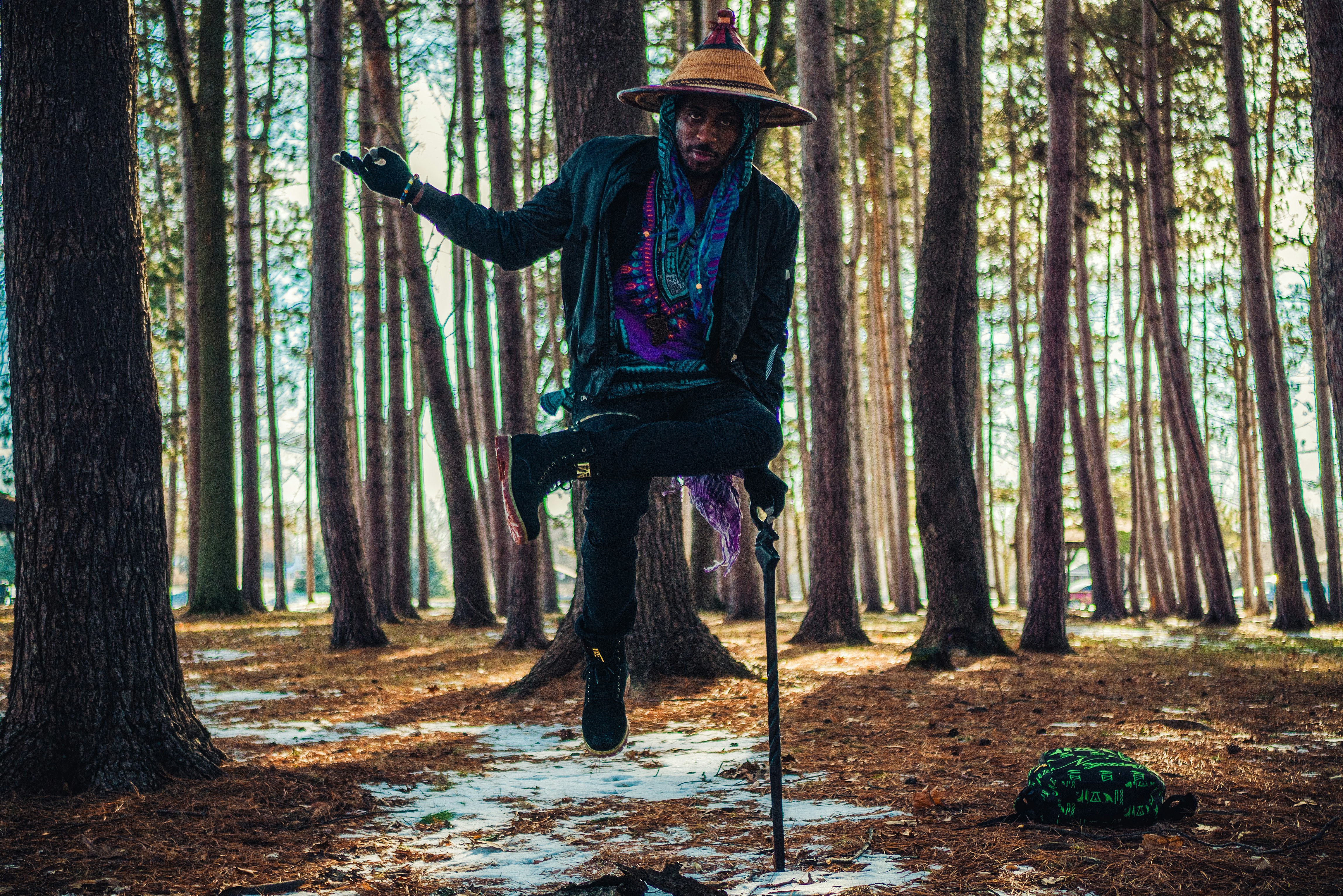 a man riding a bicycle in the woods
