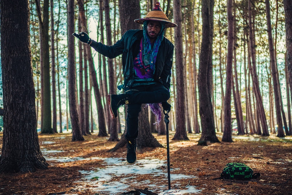 a man riding a bicycle in the woods