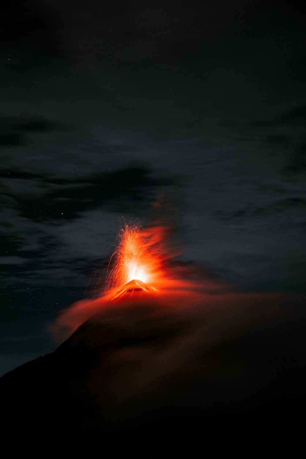 a large mushroom cloud in the dark