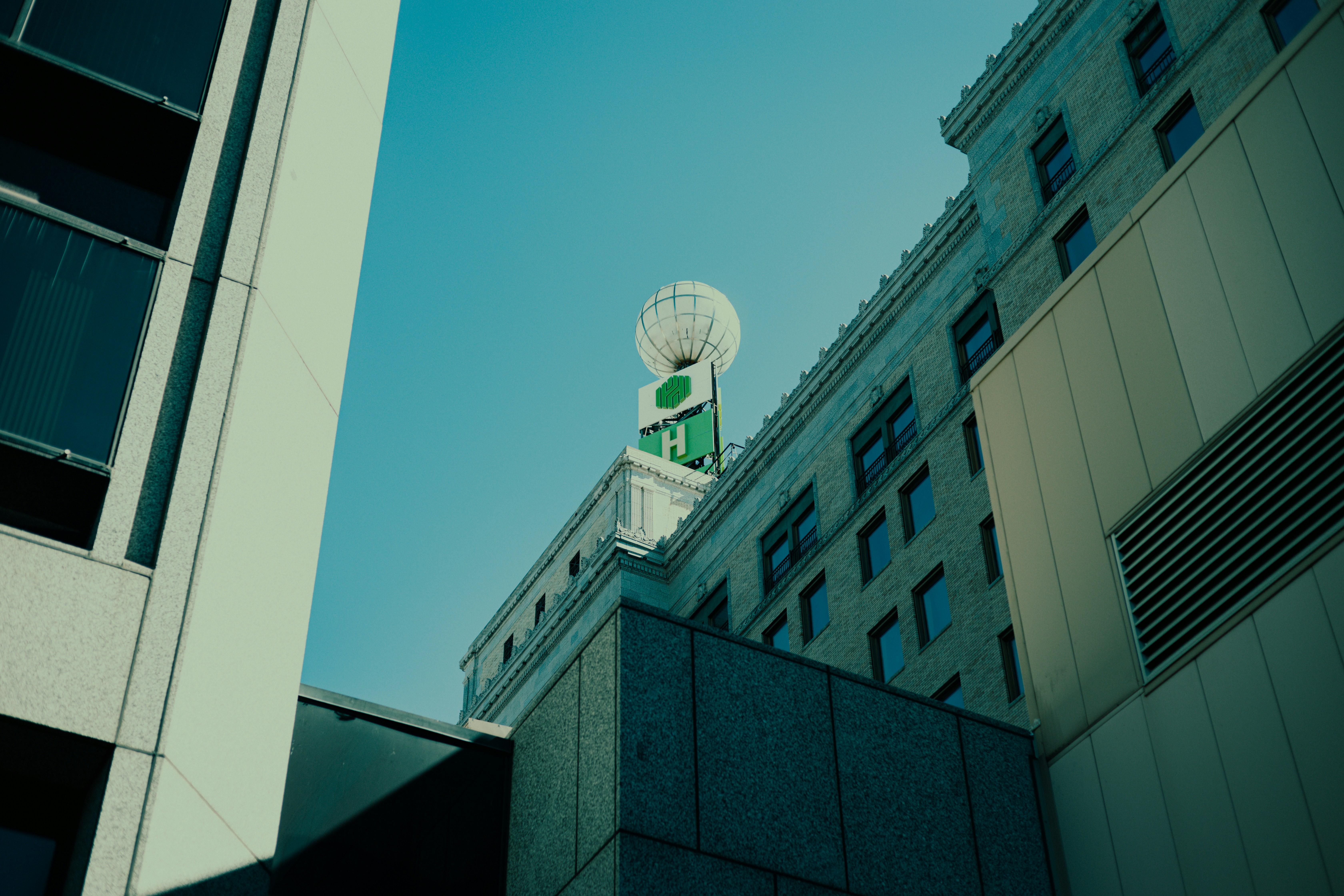 a building with a round white tower