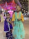 Two smiling twin sisters wearing matching festival outfits, holding hands under colorful festival lights.
