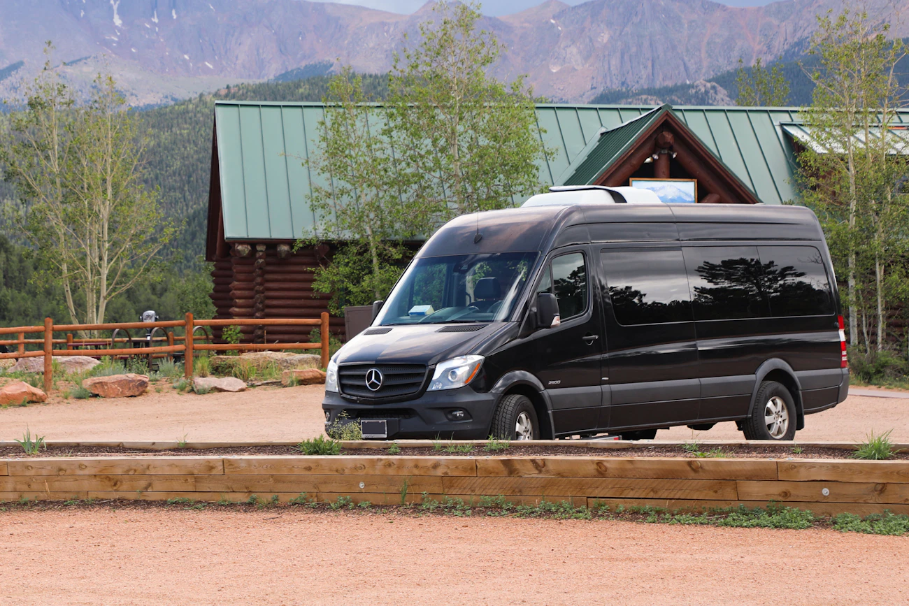 Black Mercedes-Benz Sprinter passenger van