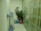 Office reception area with a Yadav Aqua water dispenser and employees chatting nearby.