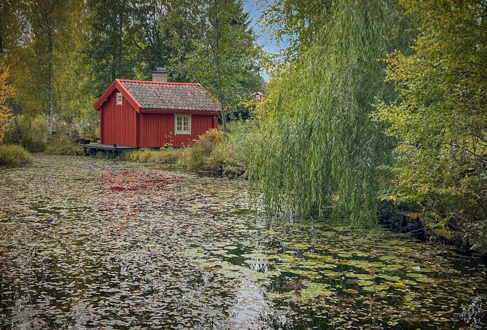 a red house by a river
