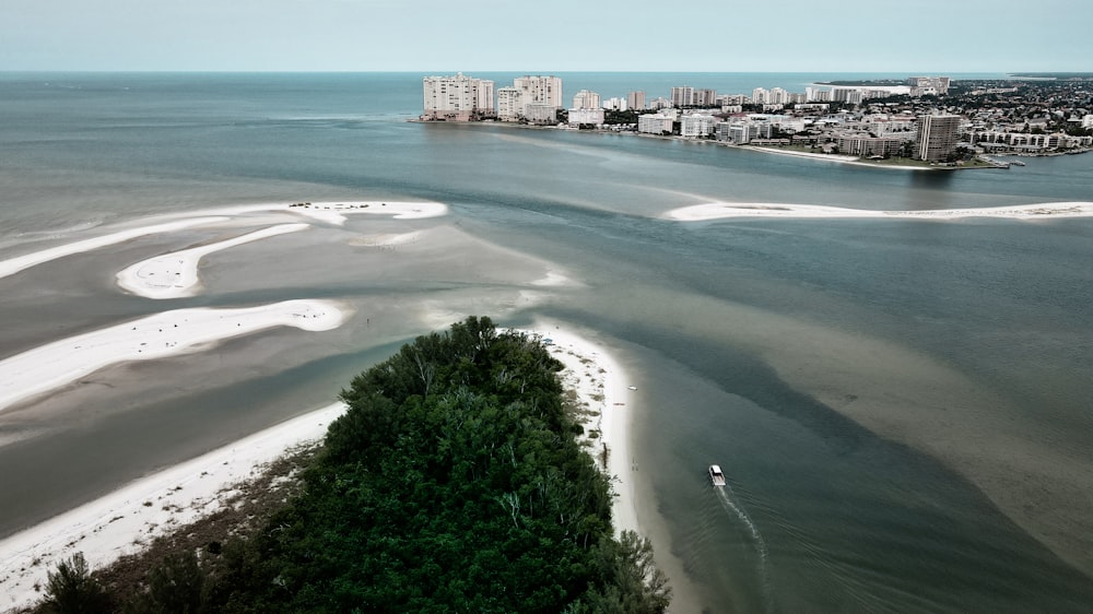 a beach with buildings in the background