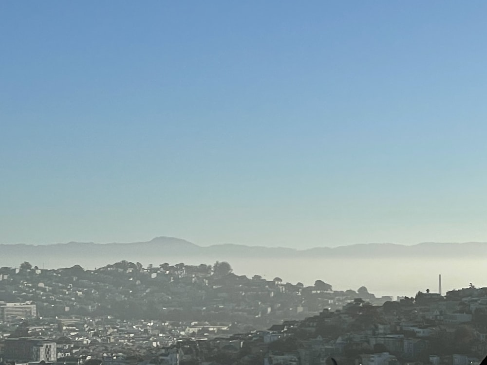 a city with mountains in the background