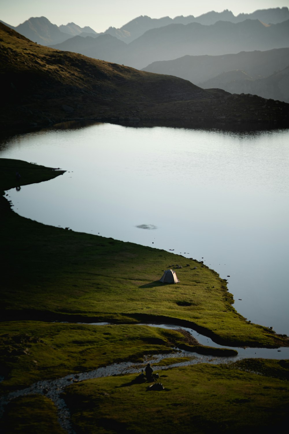 a lake surrounded by mountains