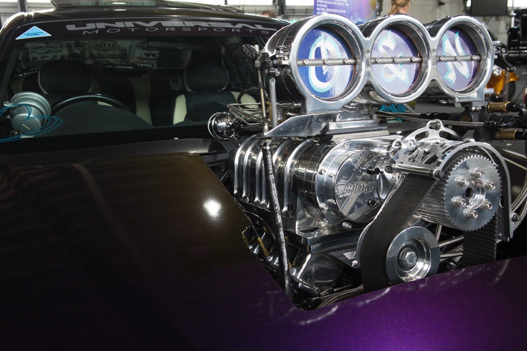 a car with its engine exposed,