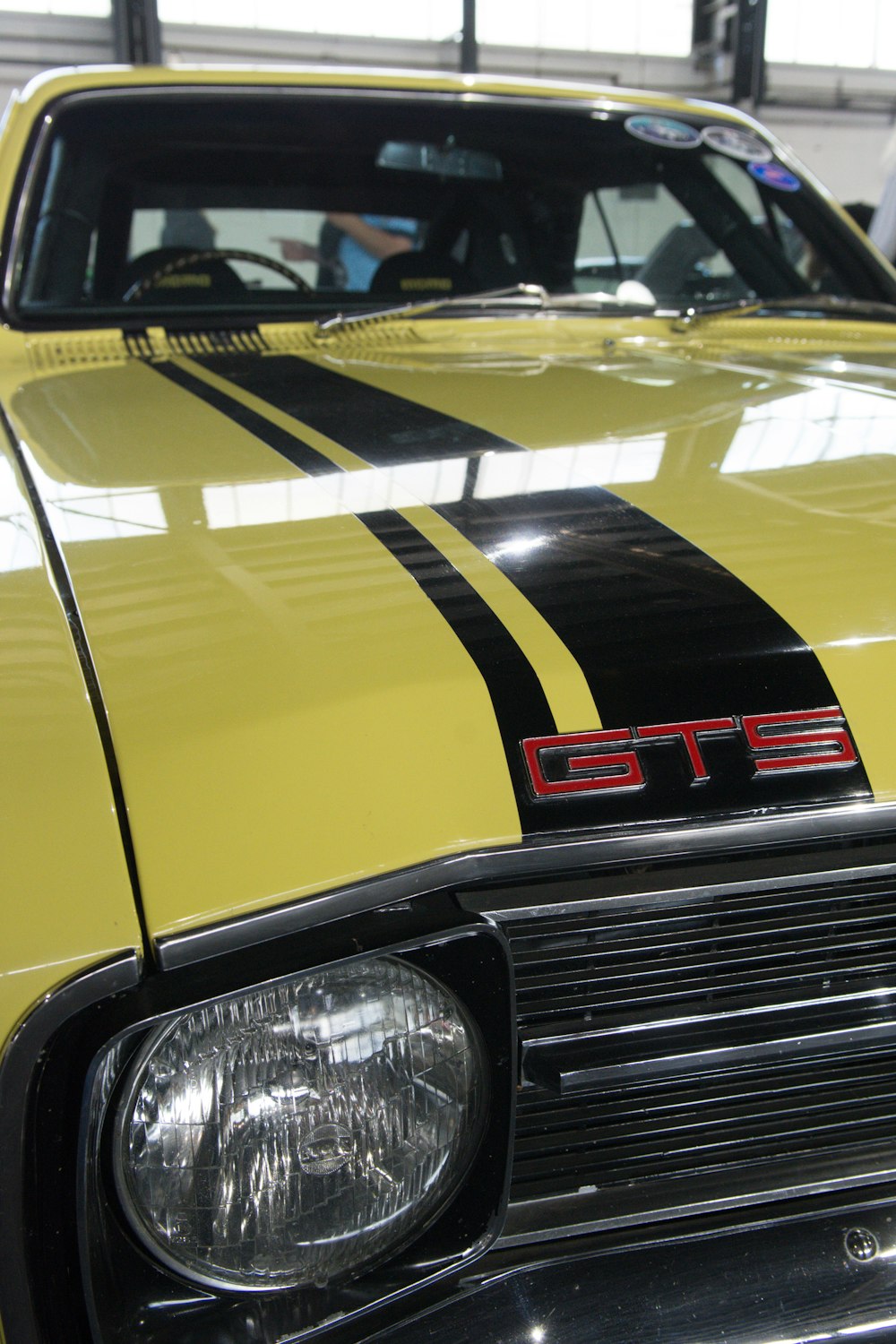 the front of a yellow sports car