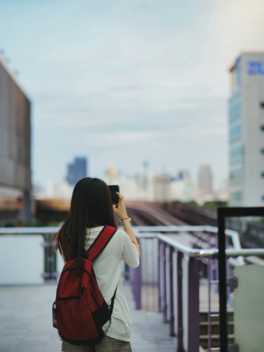 a person taking a picture of a city