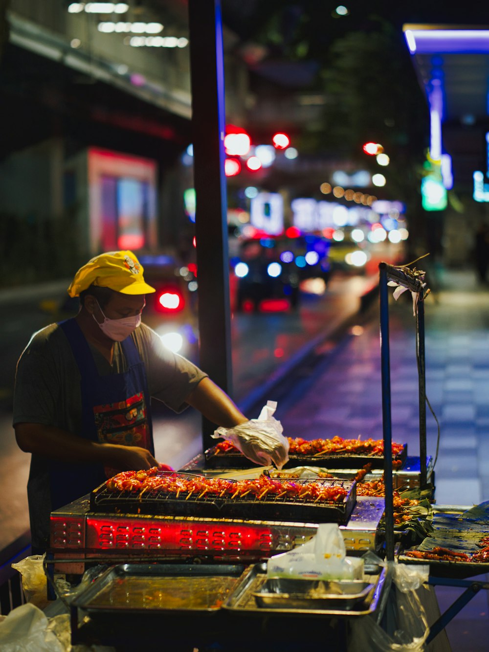 a person cooking food on a grill