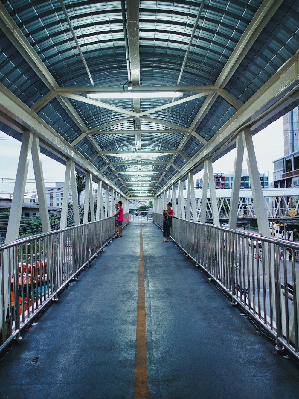 a long hallway with people walking