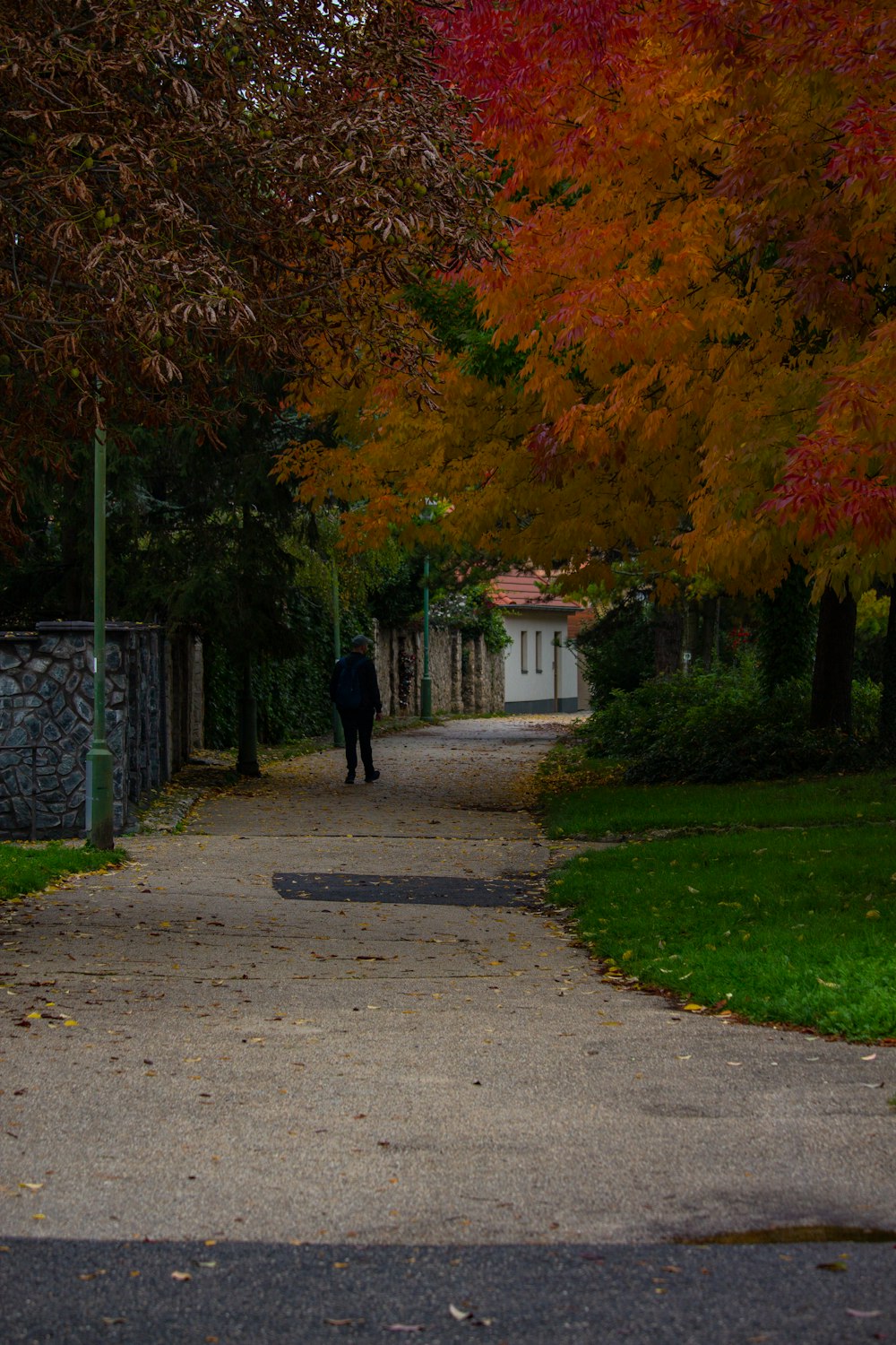 a person walking down a sidewalk