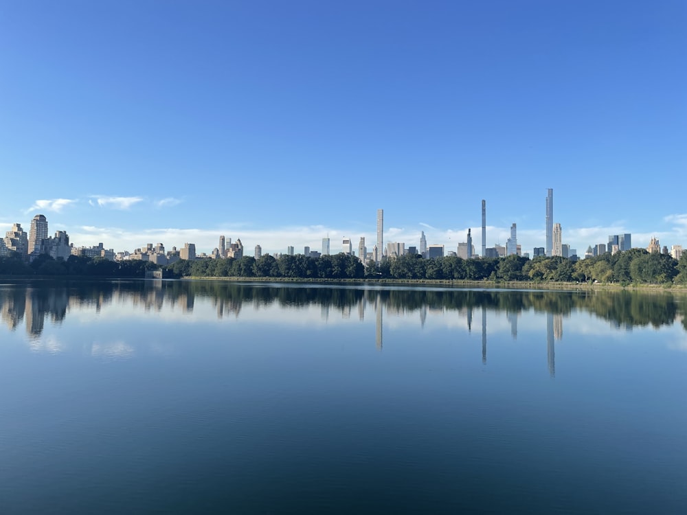 a body of water with a city in the background