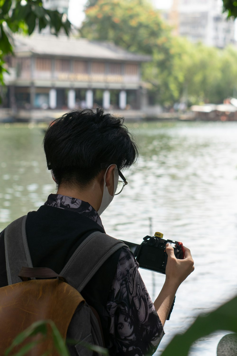 a man taking a picture of a river