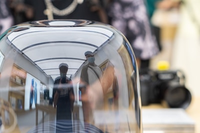 Reflection of code on Apple Pro Display glasses in a candid workspace