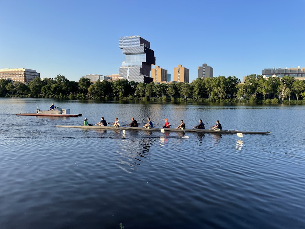 a group of people rowing boats