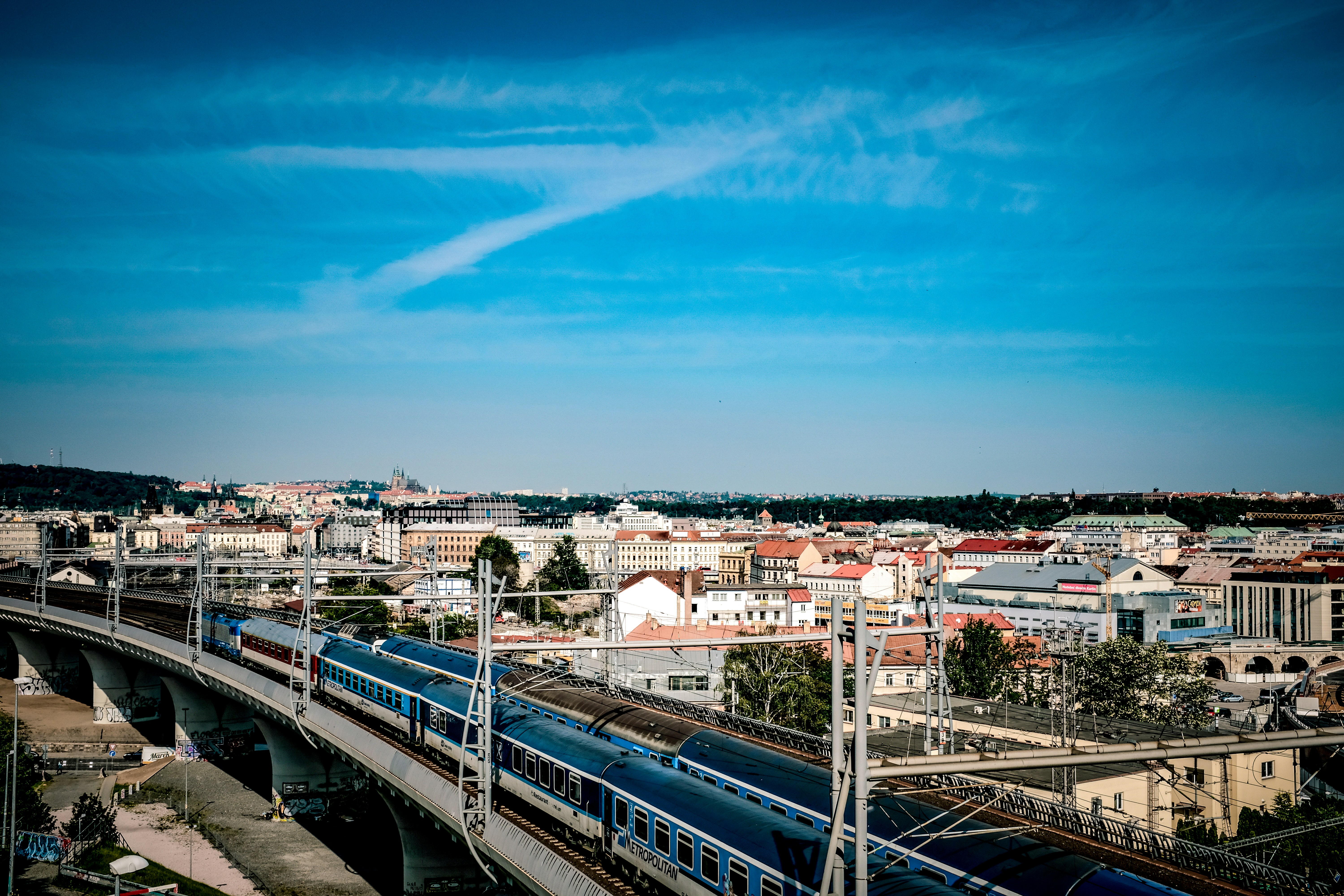 a train on a bridge over a river