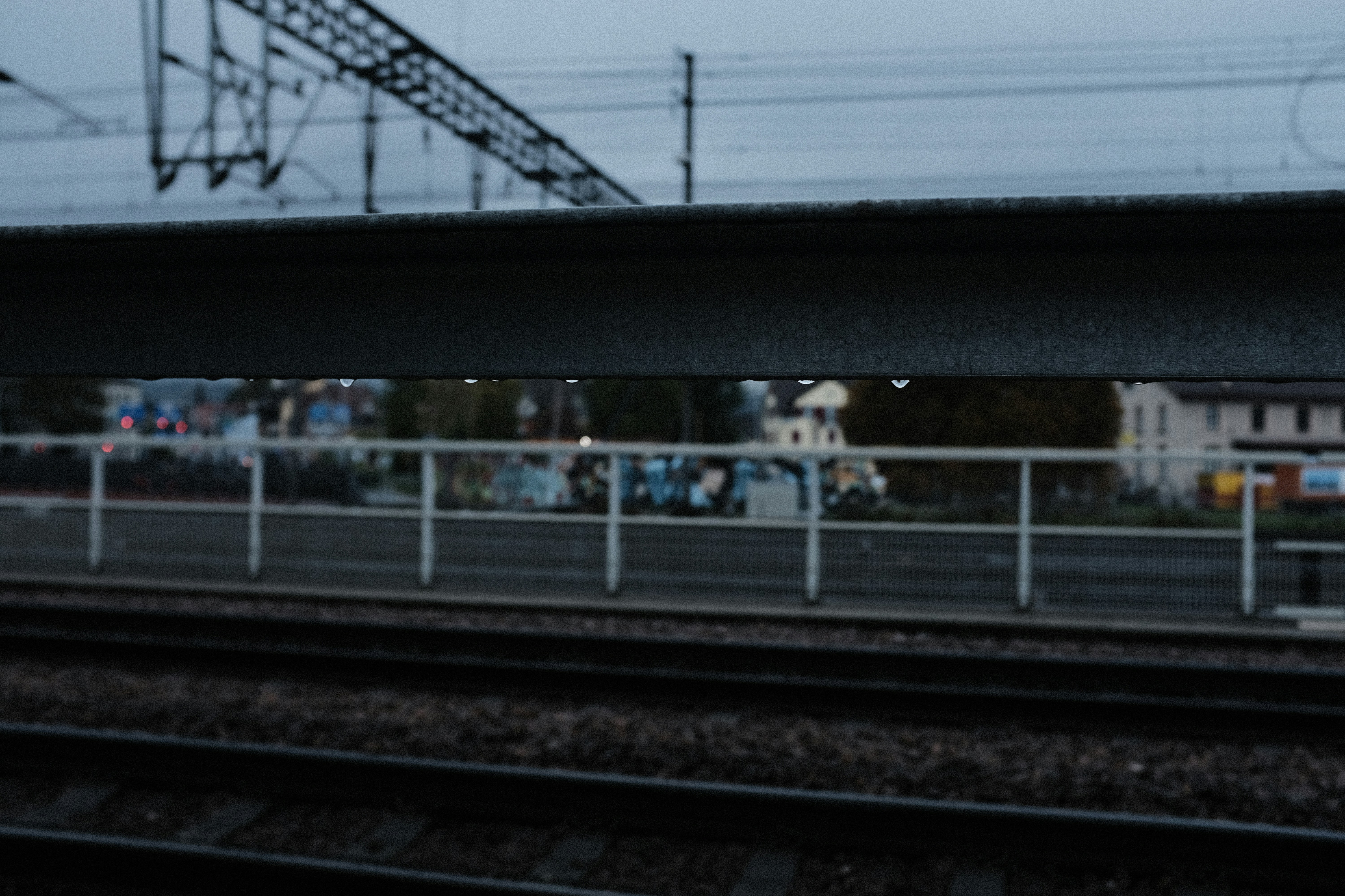 a train track with a bridge above it