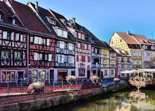 a row of buildings next to a body of water